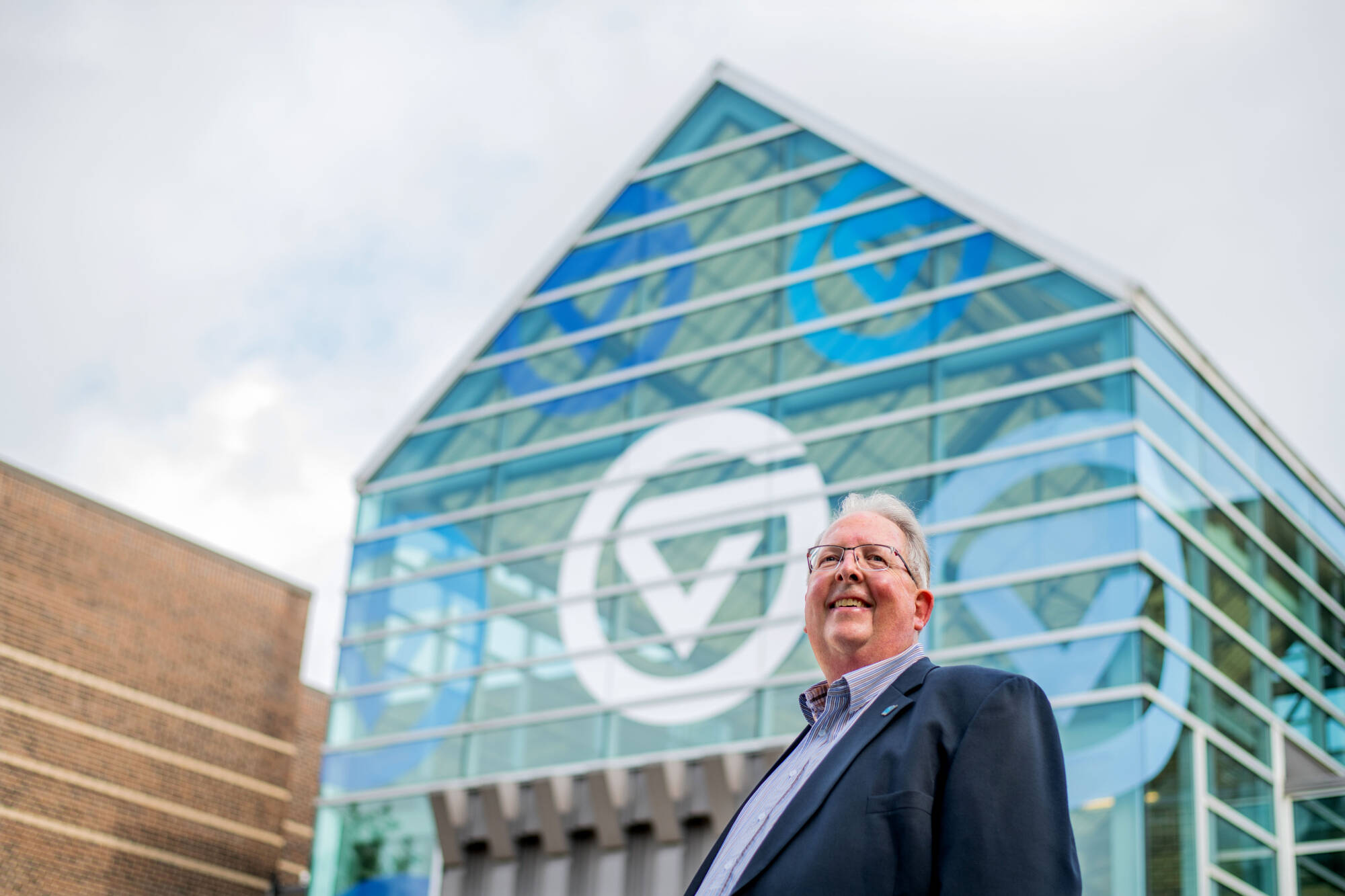 Bob Stoll standing in front of the Kirkhof Center